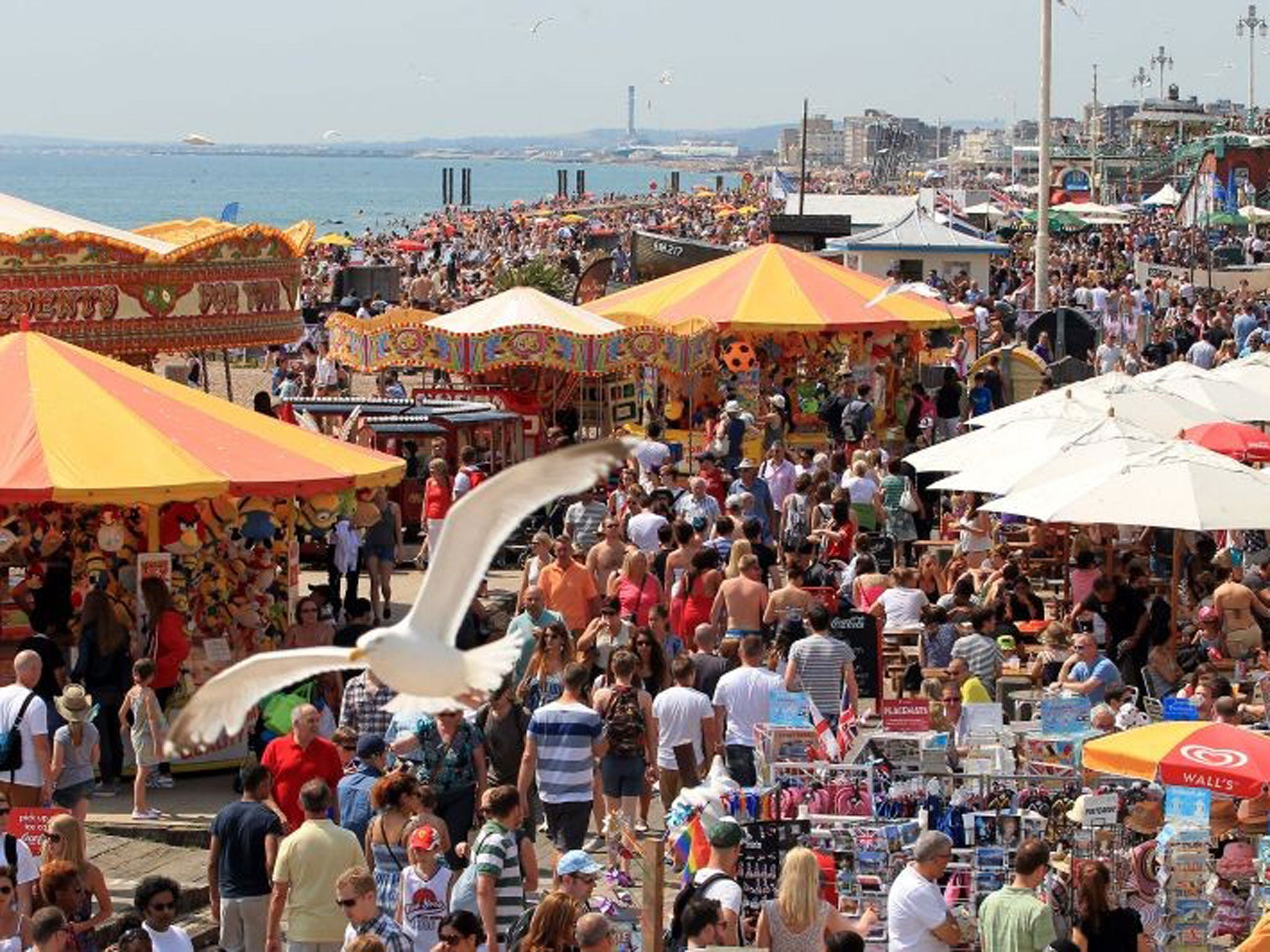 Revellers gather on Brighton beach as July promises more hot weather