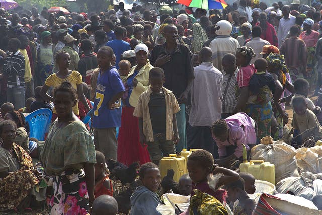 Congolese refugees wait at the Busunga border post in Uganda