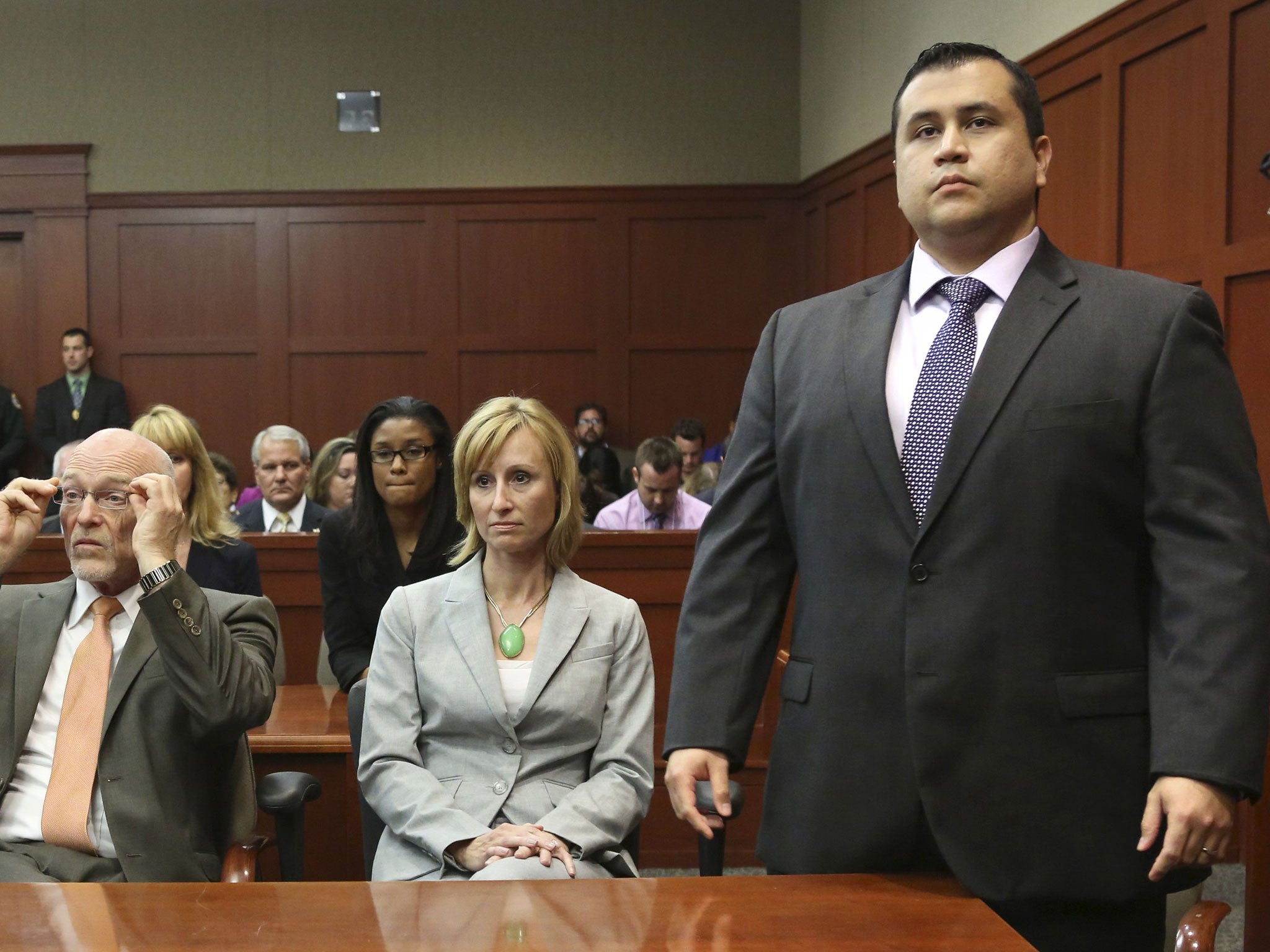 George Zimmerman stands when the jury arrives to deliver the verdict