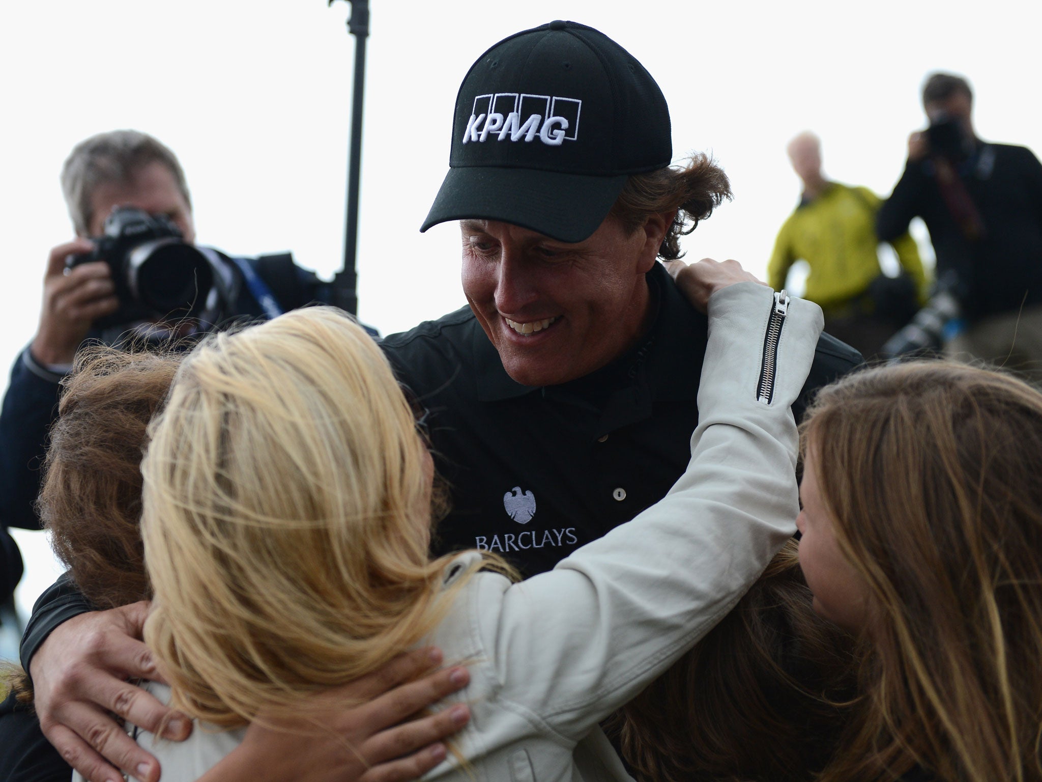 A jubilant Phil Mickelson celebrates winning with his family