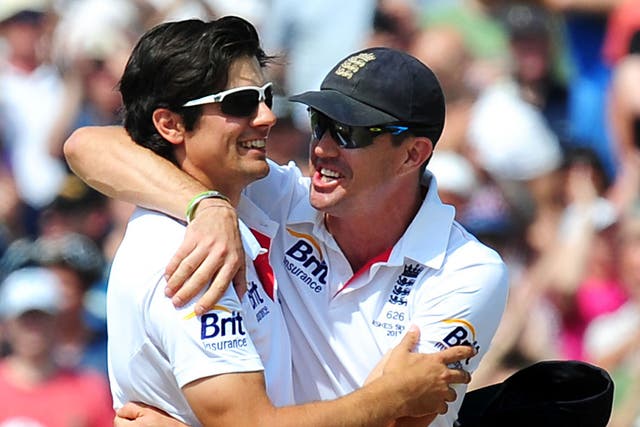 Alastair Cook, left, celebrates with Kevin Pietersen, right