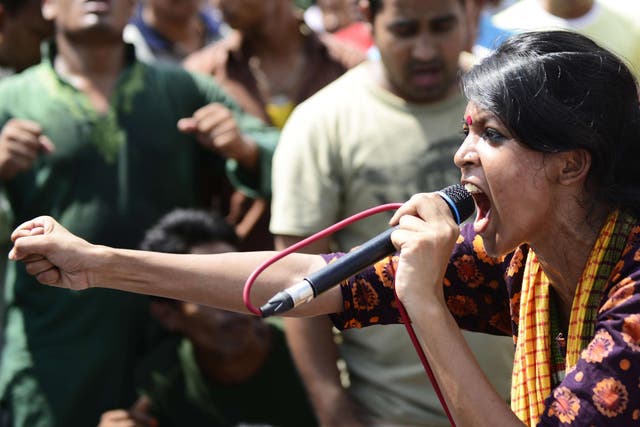 A Bangladeshi social activist shouts slogans against Ghulam Azam, whom she and other protesters wished to be sentenced to death, outside a court in Dhaka