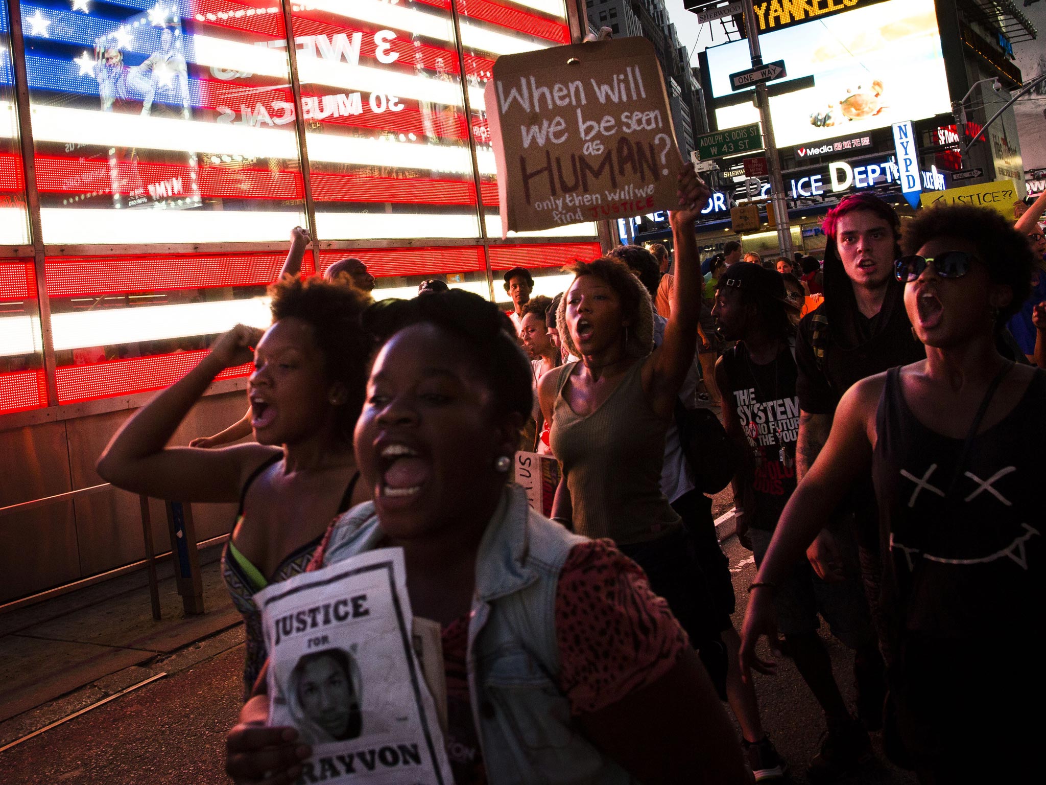 Demonstrators enter Times Square in New York, during a march against the acquittal of neighborhood watch member George Zimmerman in the killing of 17-year-old Trayvon Martin in Florida