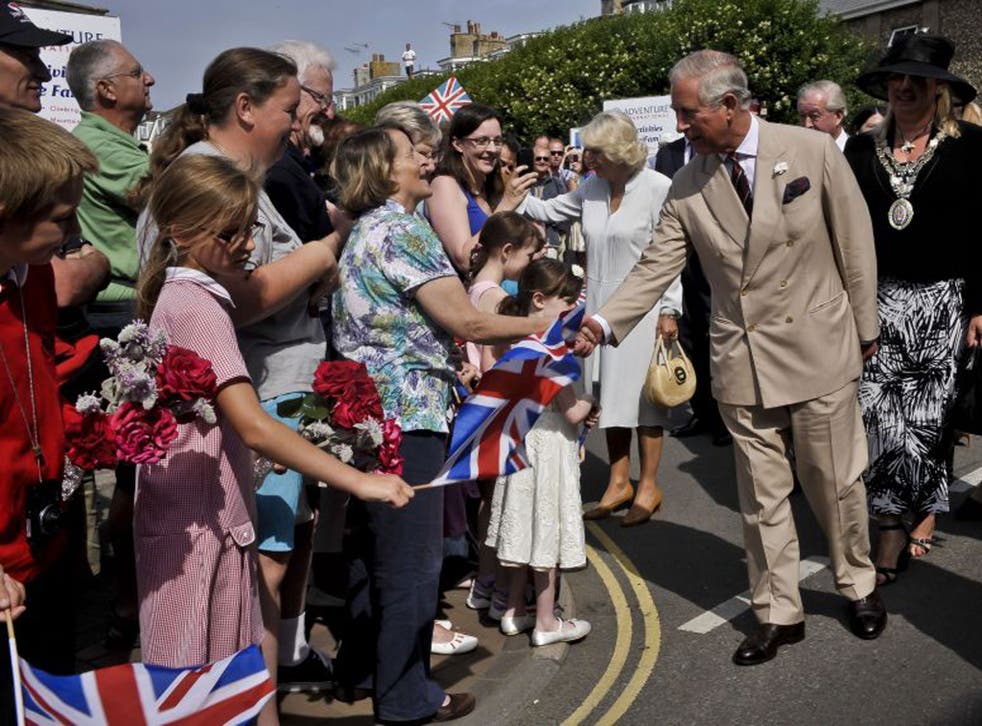 The Prince of Wales greets wellwishers in the Cornish resort of Bude yesterday as he and the Duchess  of Cornwall start their annual three-day tour of Devon and Cornwall