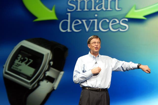 Bill Gates shows off the original Microsoft smart watch - the Fossil SPOT - in 2003. Reuters/Jeff Christensen