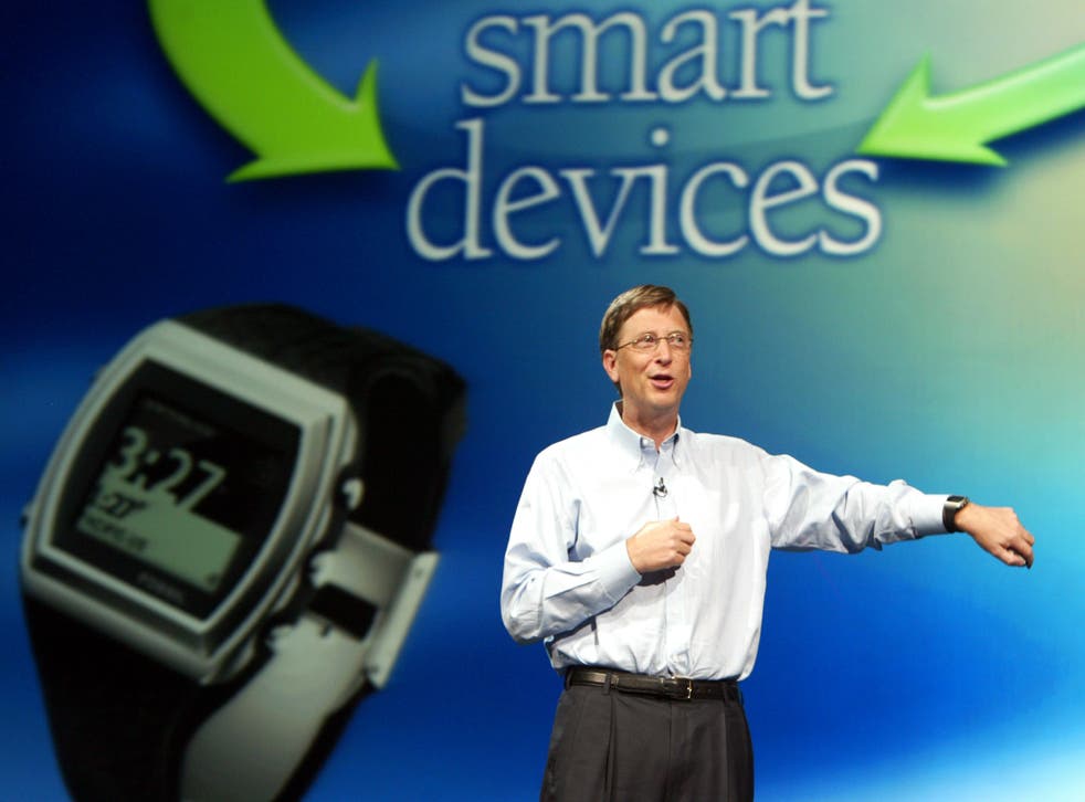 Bill Gates shows off the original Microsoft smart watch - the Fossil SPOT - in 2003. Reuters/Jeff Christensen