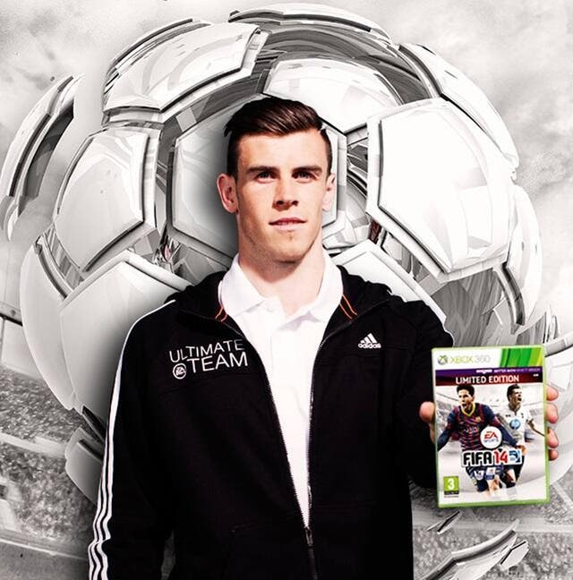 Gareth Bale with the a copy of Fifa 14