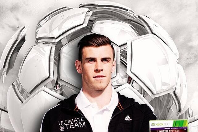 Gareth Bale with the a copy of Fifa 14
