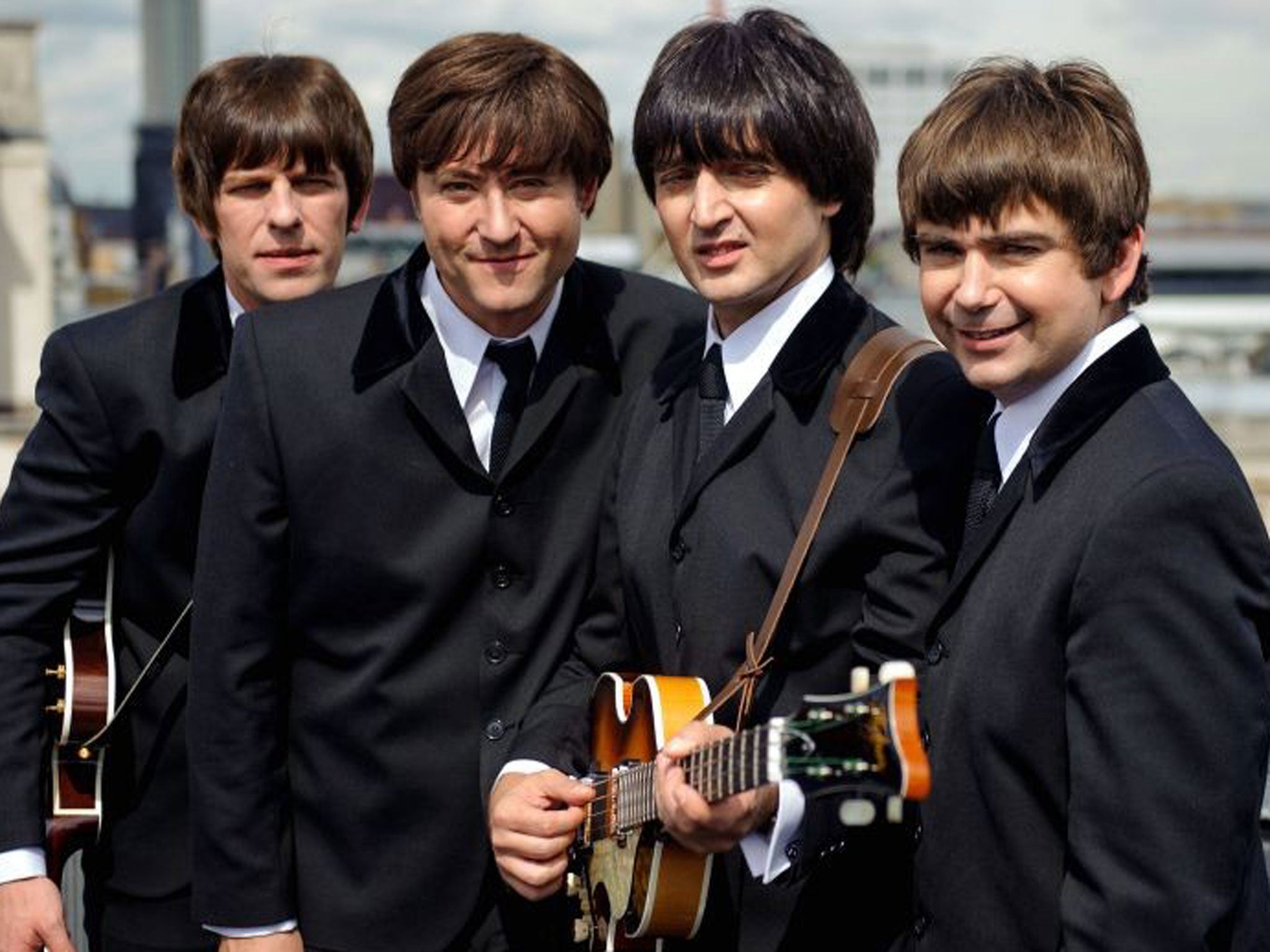 Cast members of the new Beatles musical 'Let It Be', whose producers are being sued by a rival production 