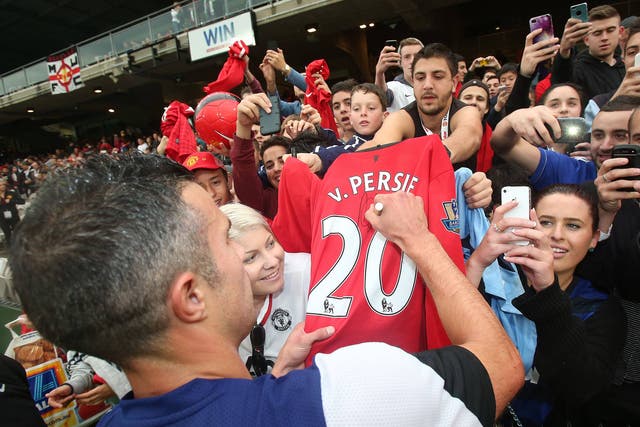 Robin van Persie of Manchester United signs autographs after a first team training session at Kogarah 