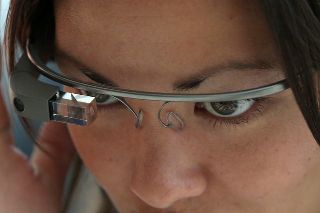 An attendee tries Google Glass during the Google I/O developer conference on May 17, 2013 (Photo by Justin Sullivan/Getty Images)