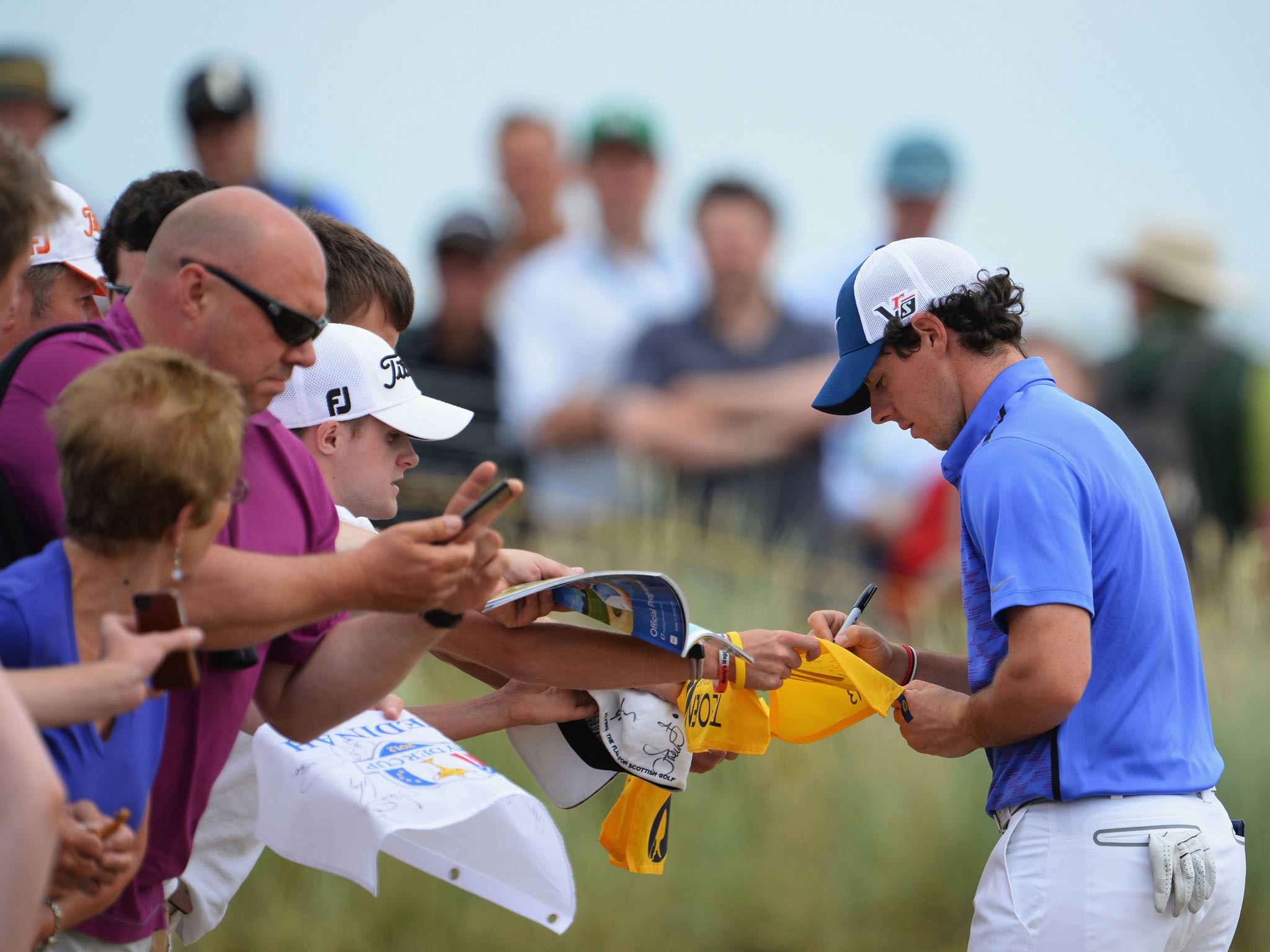 Rory McIlroy signs autographs for fans