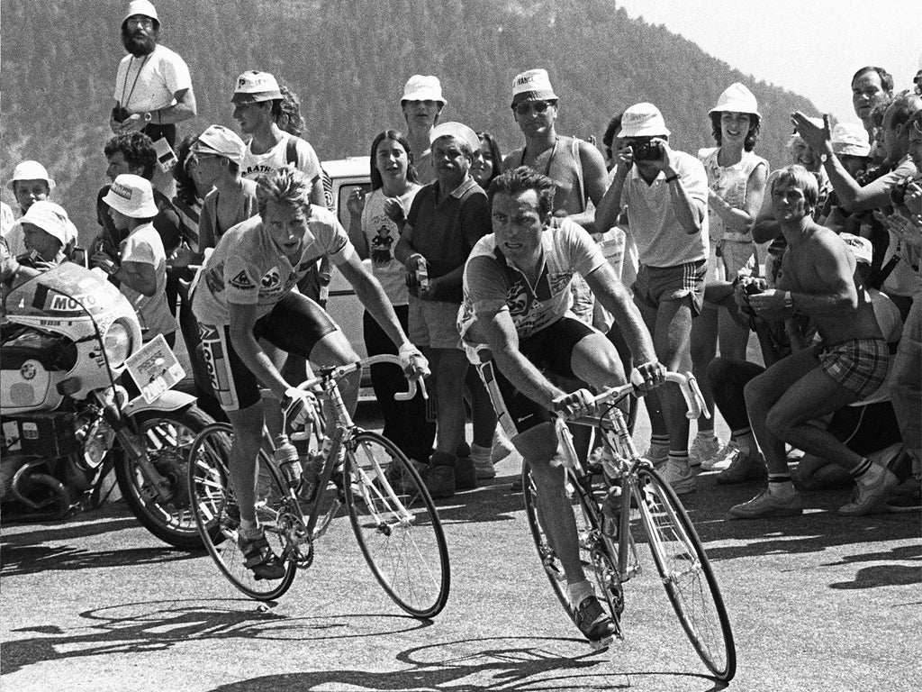 Greg Lemond (left) and Bernard Hinault tackle Alpe d’ Huez in 1986