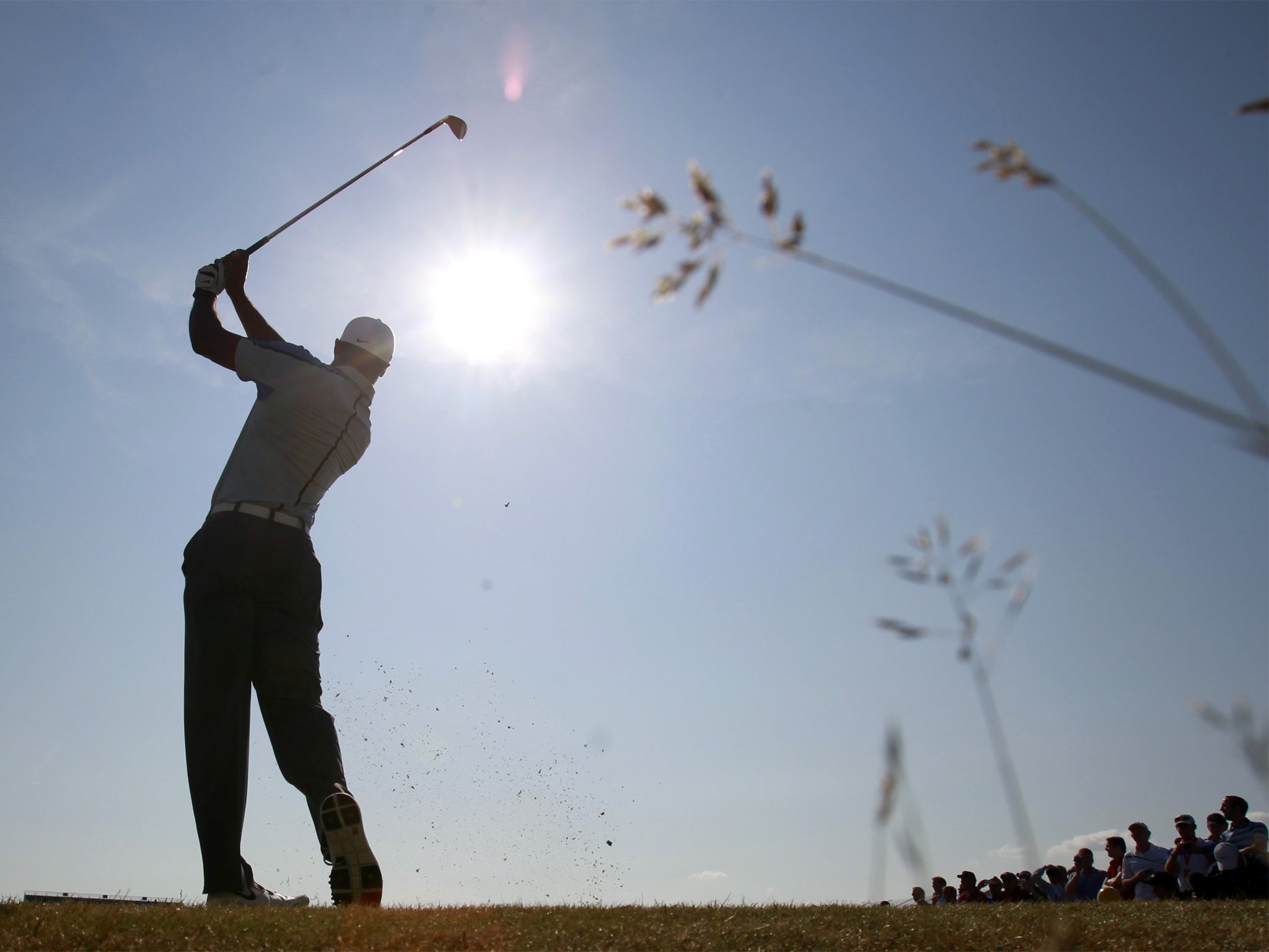 Tiger Woods plays a shot on the 15th hole during his practice round
