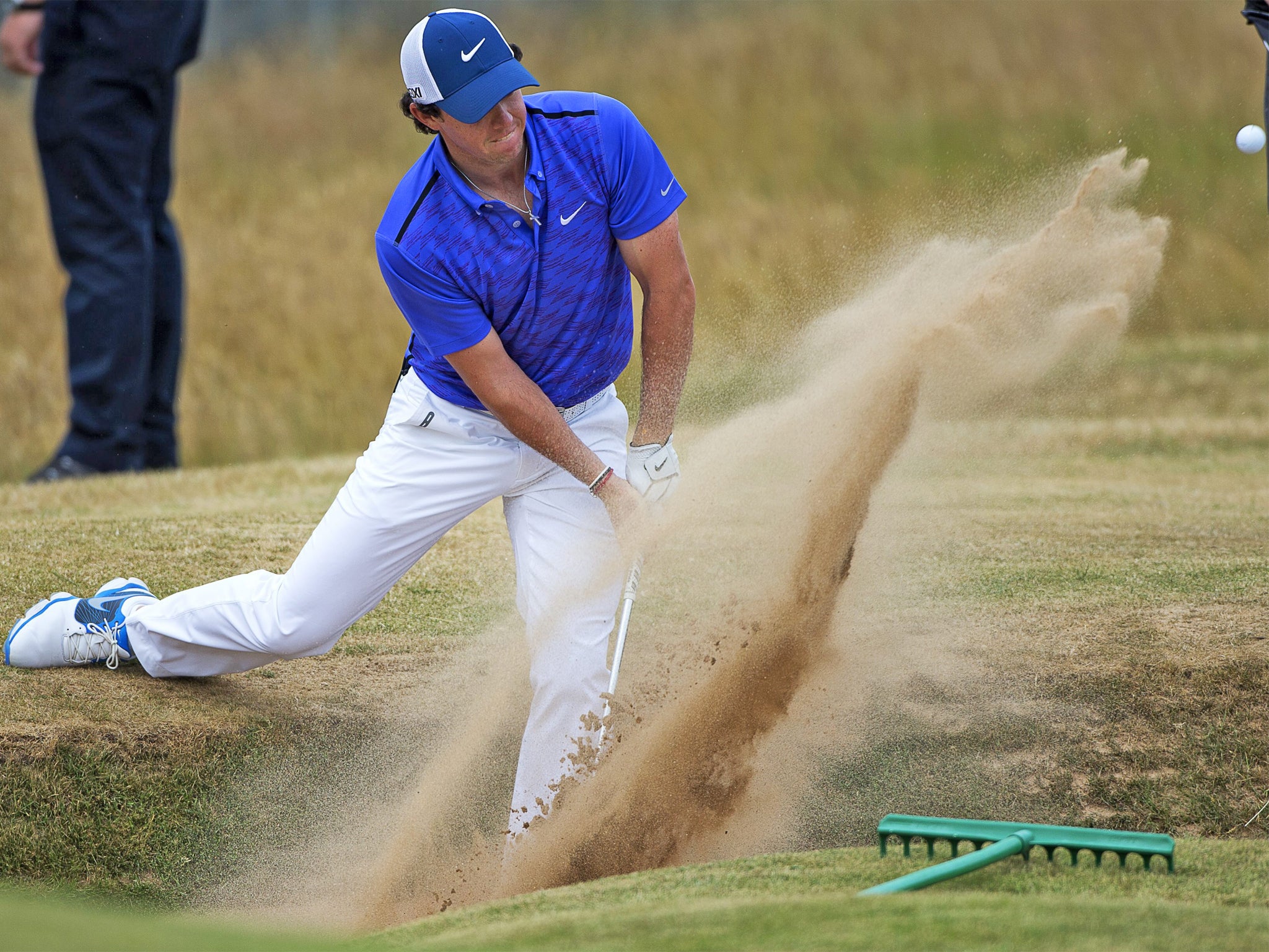 Rory McIlroy pops out of the bunker during practice