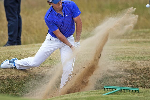Rory McIlroy pops out of the bunker during practice