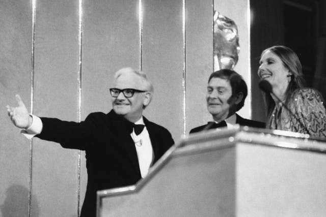 Butt, centre, with production manager Sue Bysh, receives a Bafta from Ronnie Barker for ‘Just Good Friends’ in 1987