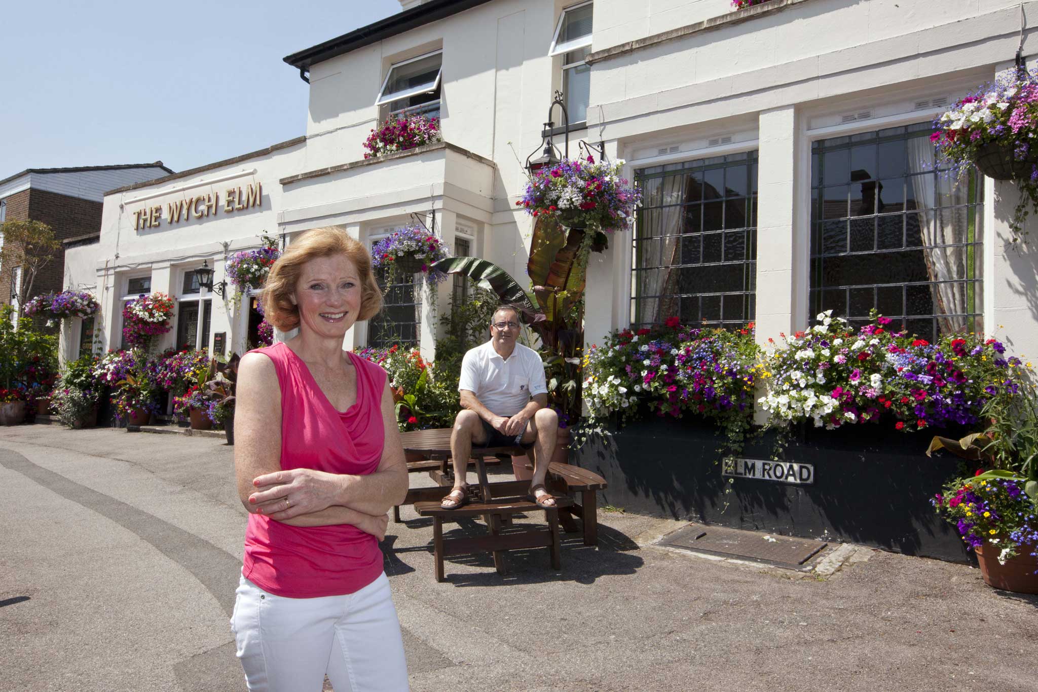 In full bloom: Janet and Manuel Turnes outside The Wych Elm pub in Kingston-upon-Thames