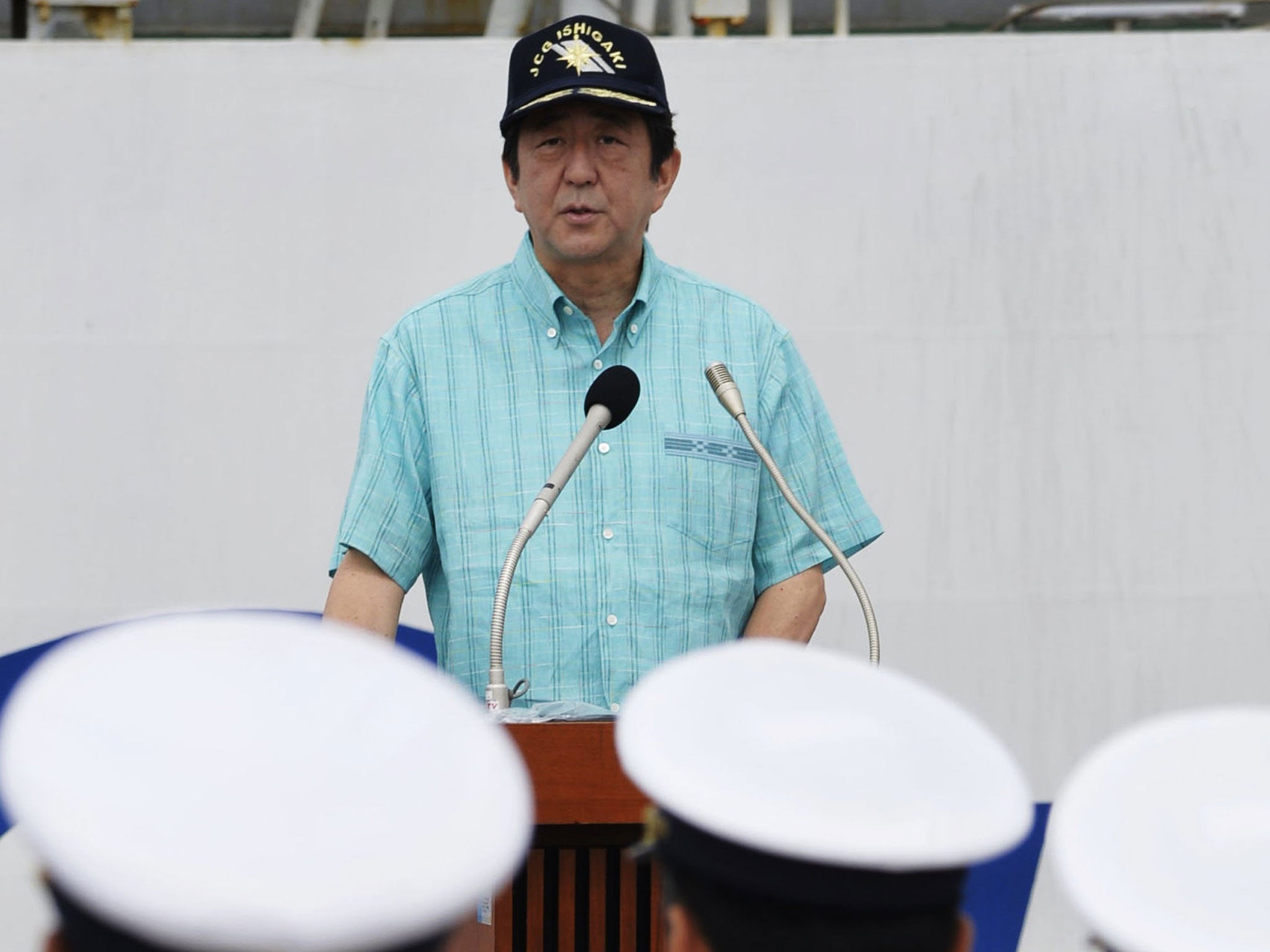 Japan’s Prime Minister Shinzo Abe delivers his speech before officers of Japan Coast Guard