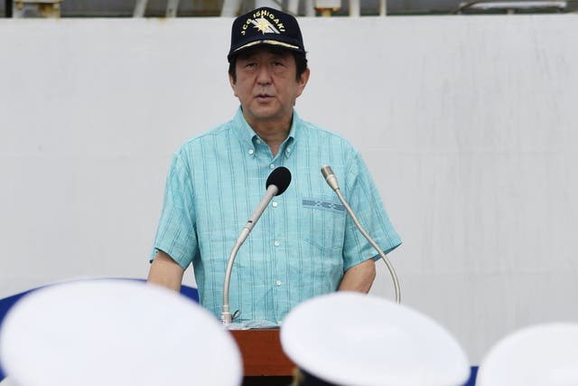 Japan’s Prime Minister Shinzo Abe delivers his speech before officers of Japan Coast Guard