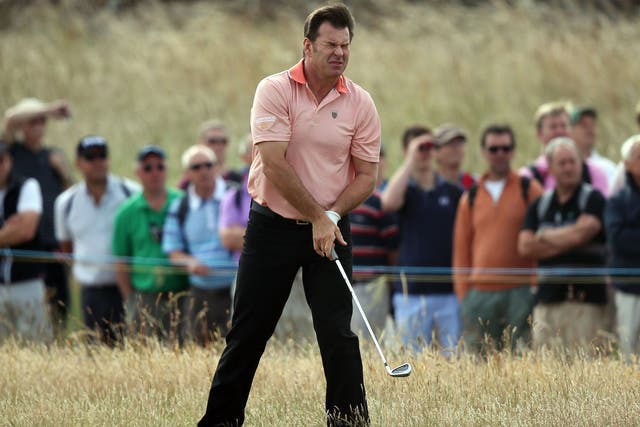 Nick Faldo cuts a frustrated figure on first fairway 