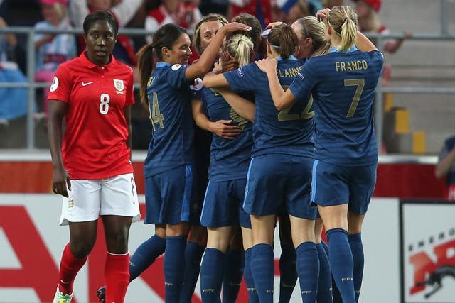 England’s Anita Asante (left) cannot look as France celebrate their first goal