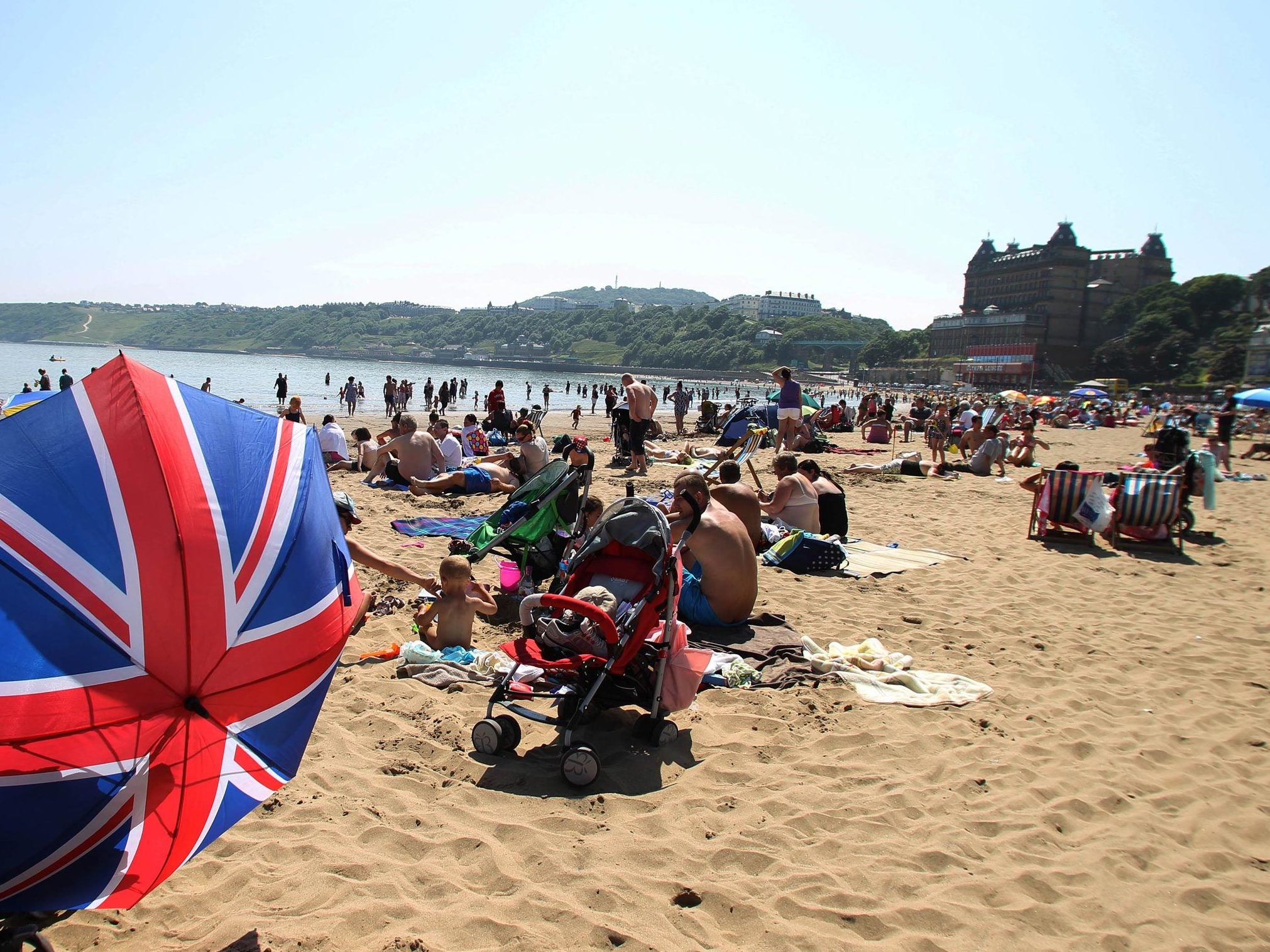 People enjoying the good weather on Scarborough beach, as the summer heatwave continues across the UK