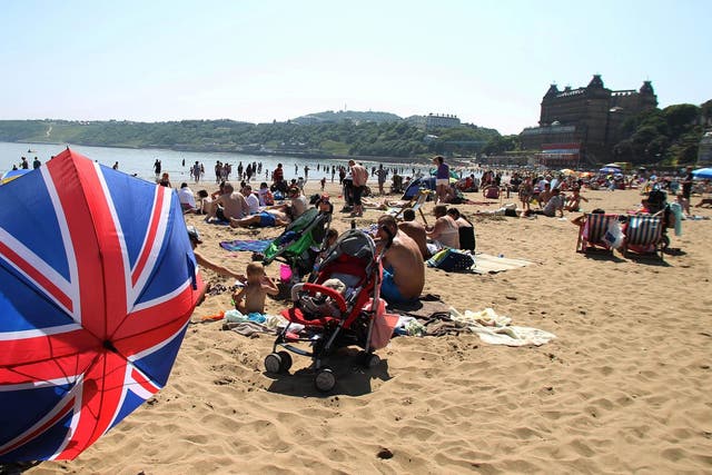 People enjoying the good weather on Scarborough beach, as the summer heatwave continues across the UK