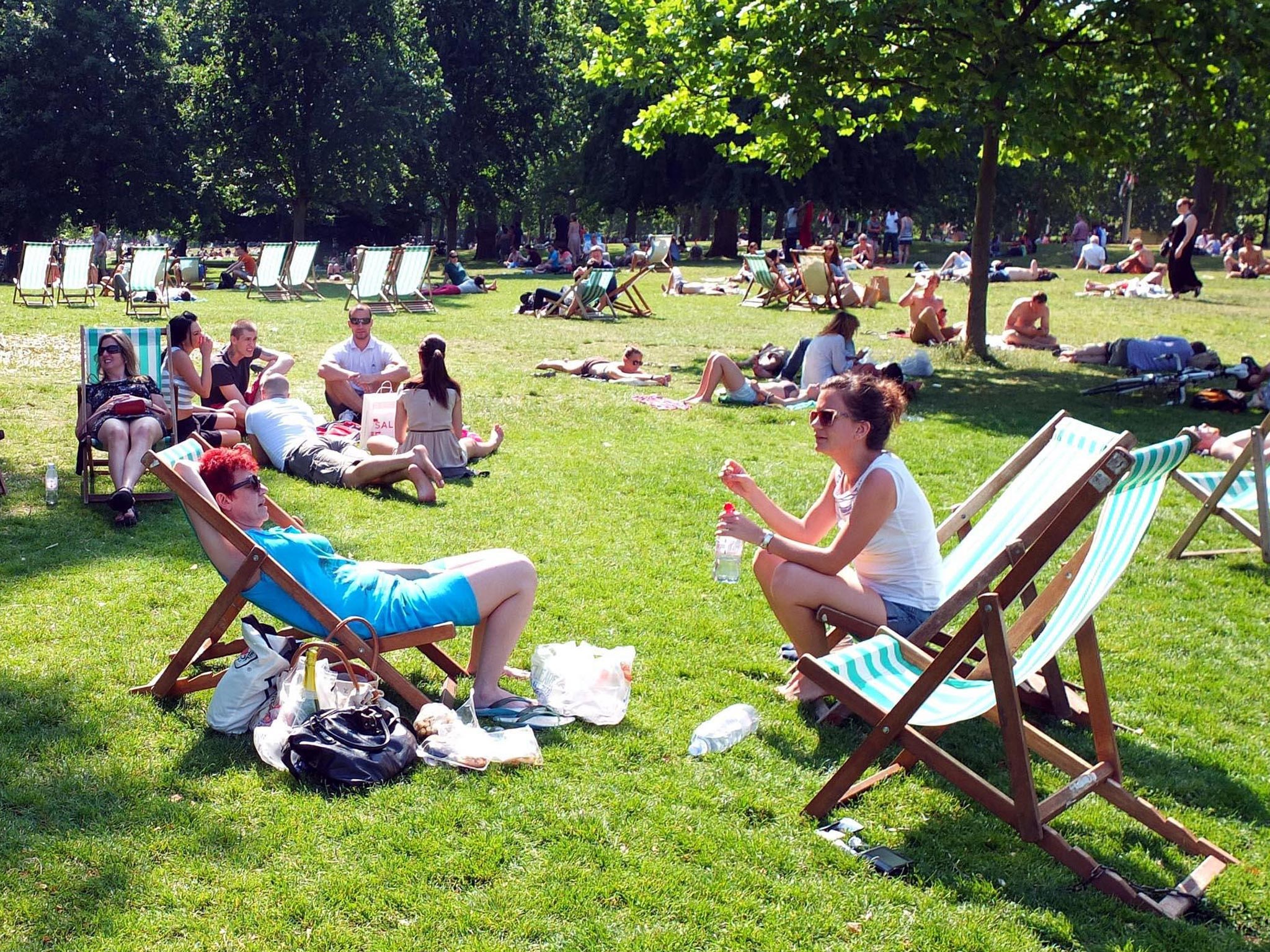 Sunbathers in St James Park, London, as much of Britain is bathed in sunshine