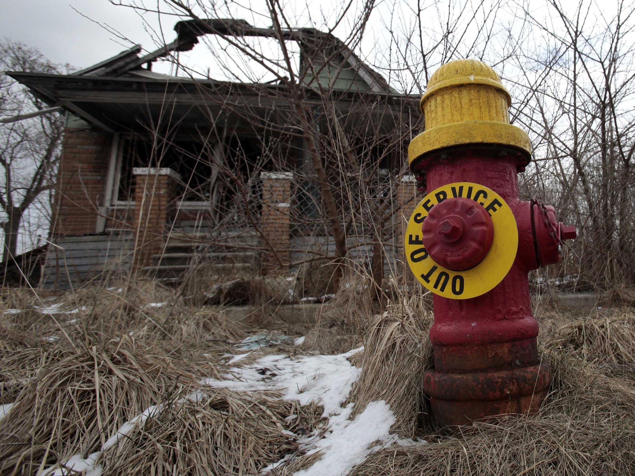March 2013: A fire hydrant is seen with an "Out of Service" sign on a blighted street on the east side of Detroit, Michigan