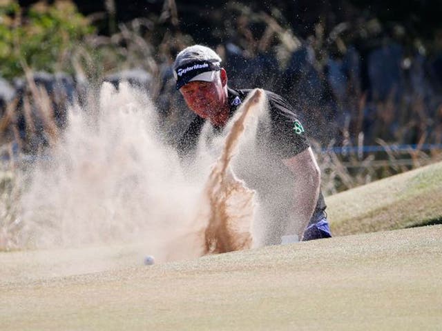 Darren Clarke thrashes around in the bunker on the sixth on his way to a quadruple bogey eight