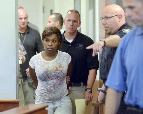 Audrea Gause is led into court after being arrested on suspicion of defrauding the One Fund Boston for $480,000