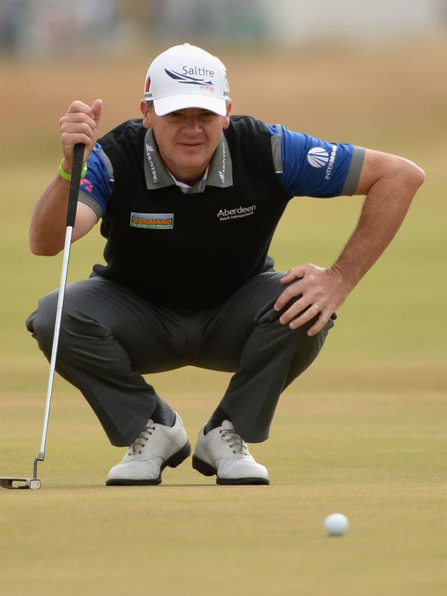Second shot: Paul Lawrie lines up a putt in the third round at Muirfield
