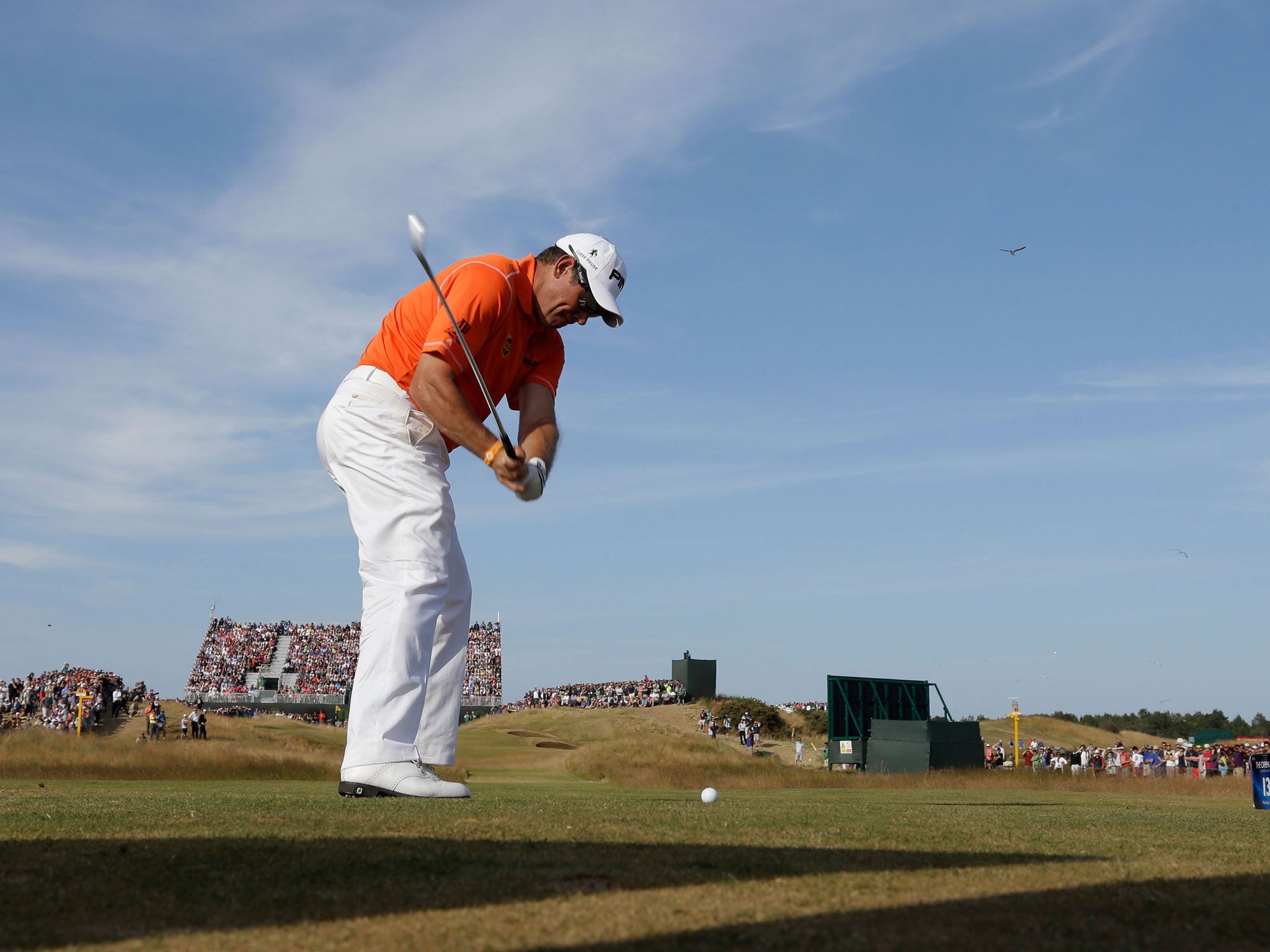 Out of the blue: Lee Westwood on the 13th tee at Muirfield on his way to a two-stroke lead