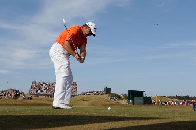 Out of the blue: Lee Westwood on the 13th tee at Muirfield on his way to a two-stroke lead  