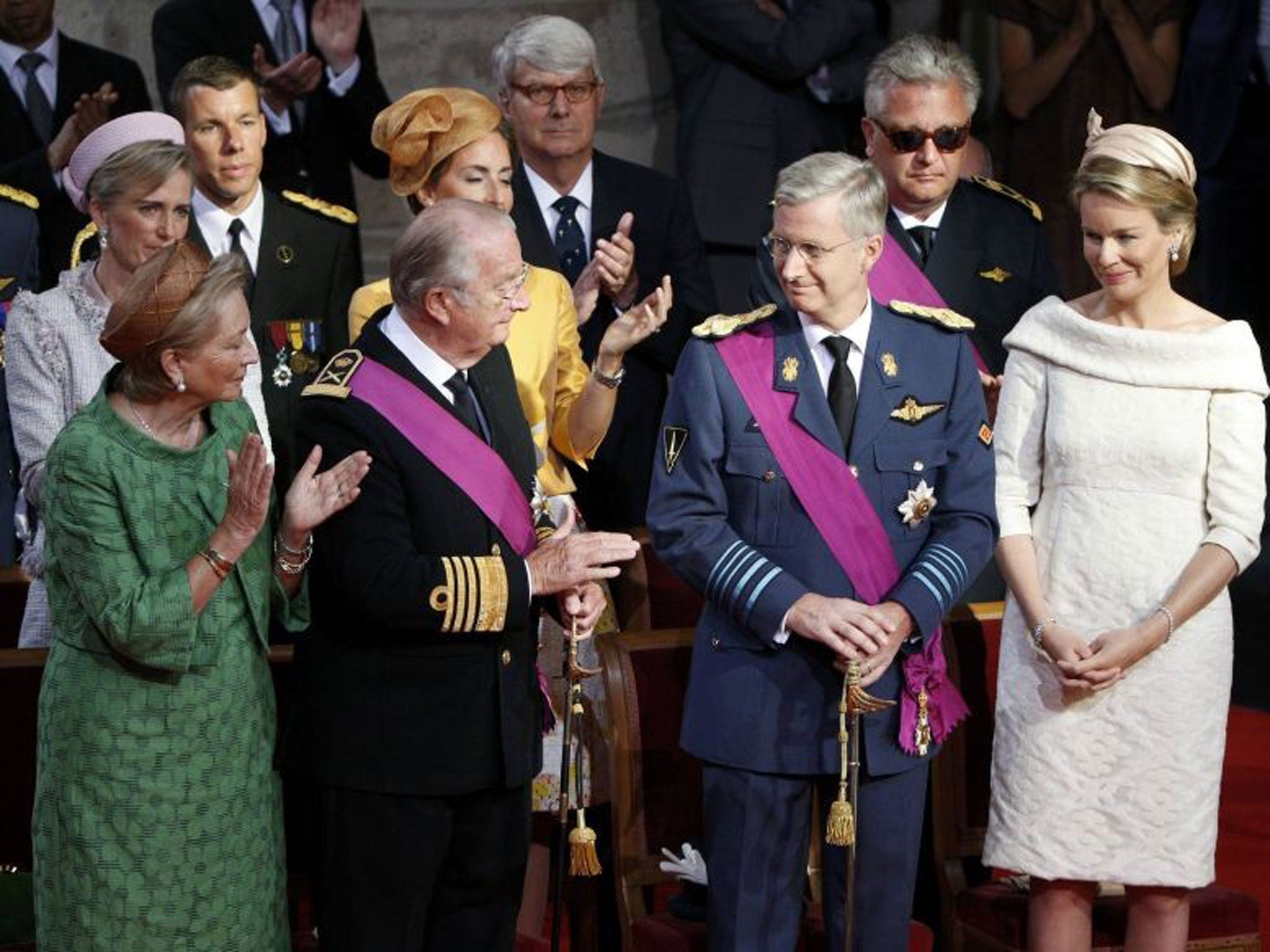 Queen Paola and King Albert II applaud Crown Prince Philippe as King Albert abdicates from the throne