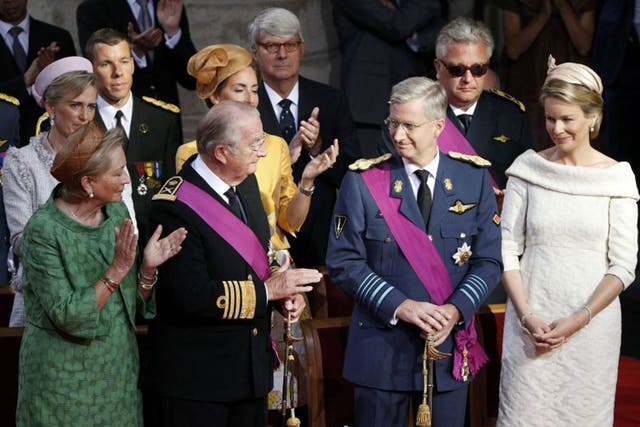 Queen Paola and King Albert II applaud Crown Prince Philippe as King Albert abdicates from the throne