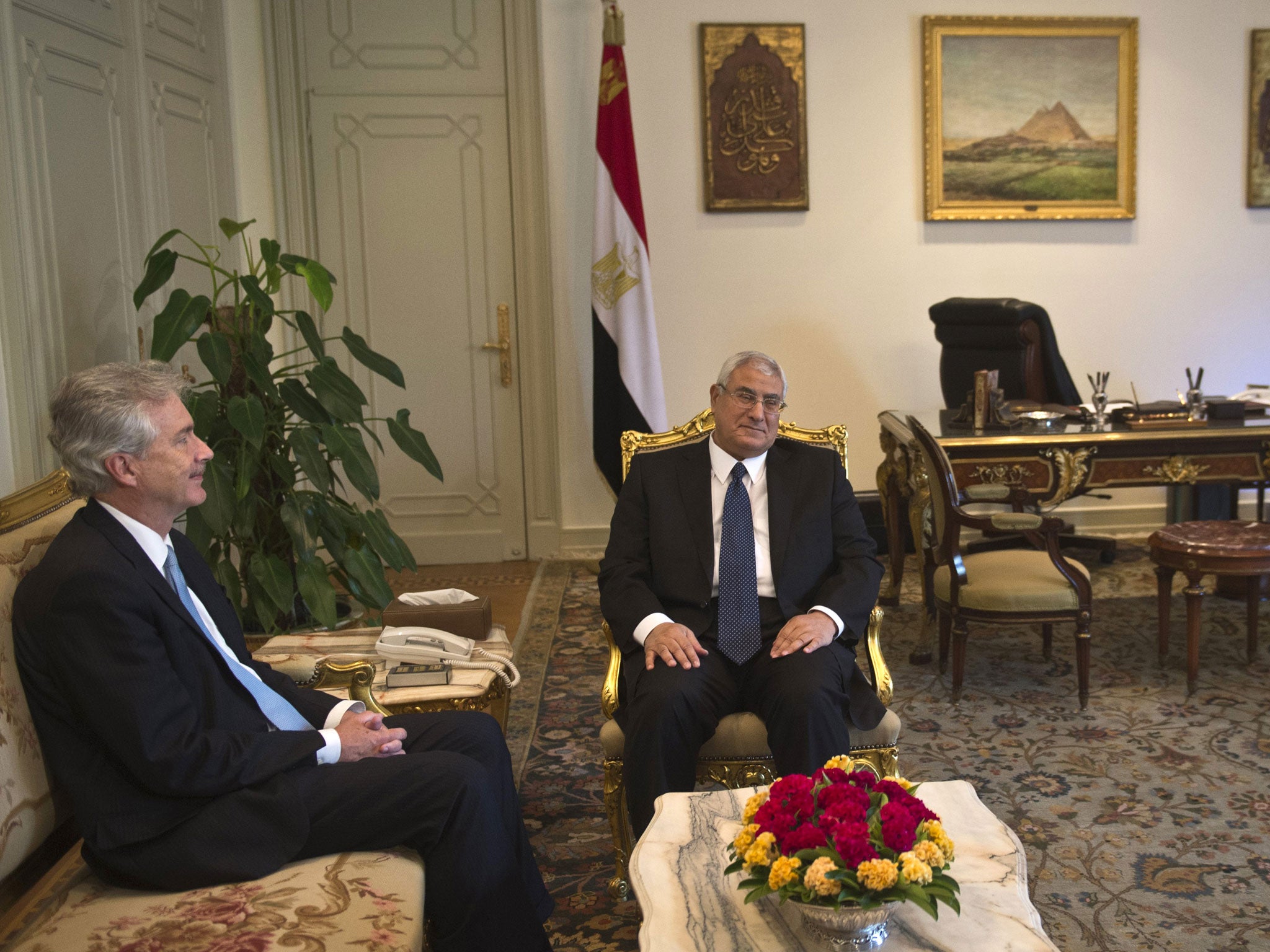 Egypt's interim president Adly Mansour meets with US Deputy Secretary of State William Burns (L) at the presidential palace in Cairo on July 15, 2013. The senior US official was in Cairo to press for a return to elected government following Mohamed Morsi's overthrow, as the Islamist leader's supporters and opponents readied rival rallies.