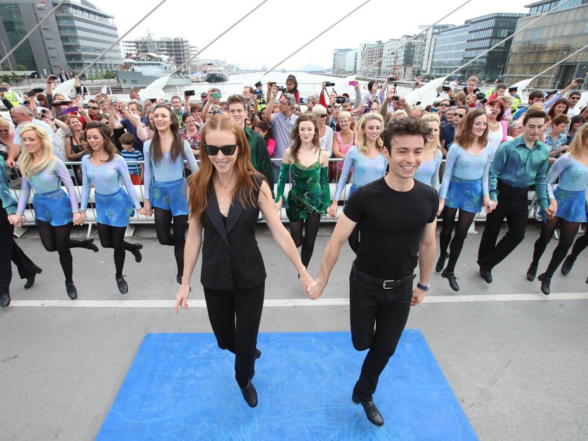 Jean Butler and Padraic Moyles lead the cast of Riverdance on Samuel Beckett Bridge during the world record attempt for the longest line of Irish dancers in Dublin