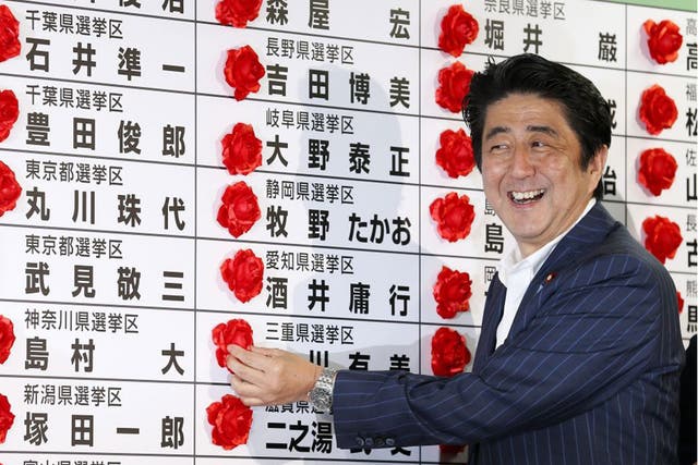 A beaming Japanese Prime Minister Shinzo Abe, who has celebrated a resounding election victory