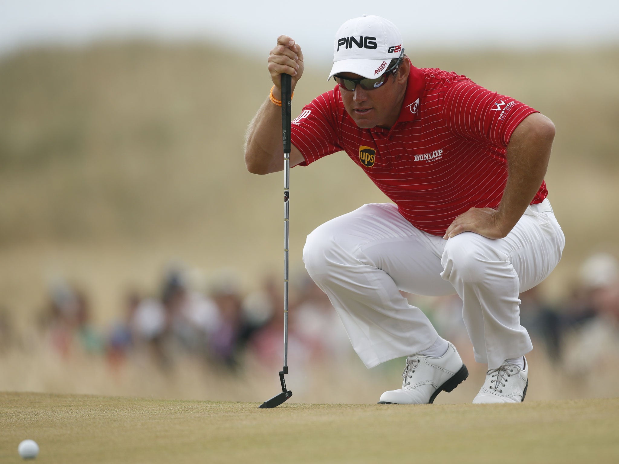 Lee Westwood of England lines up a putt on the 5th green during the final round of the British Open Golf Championship