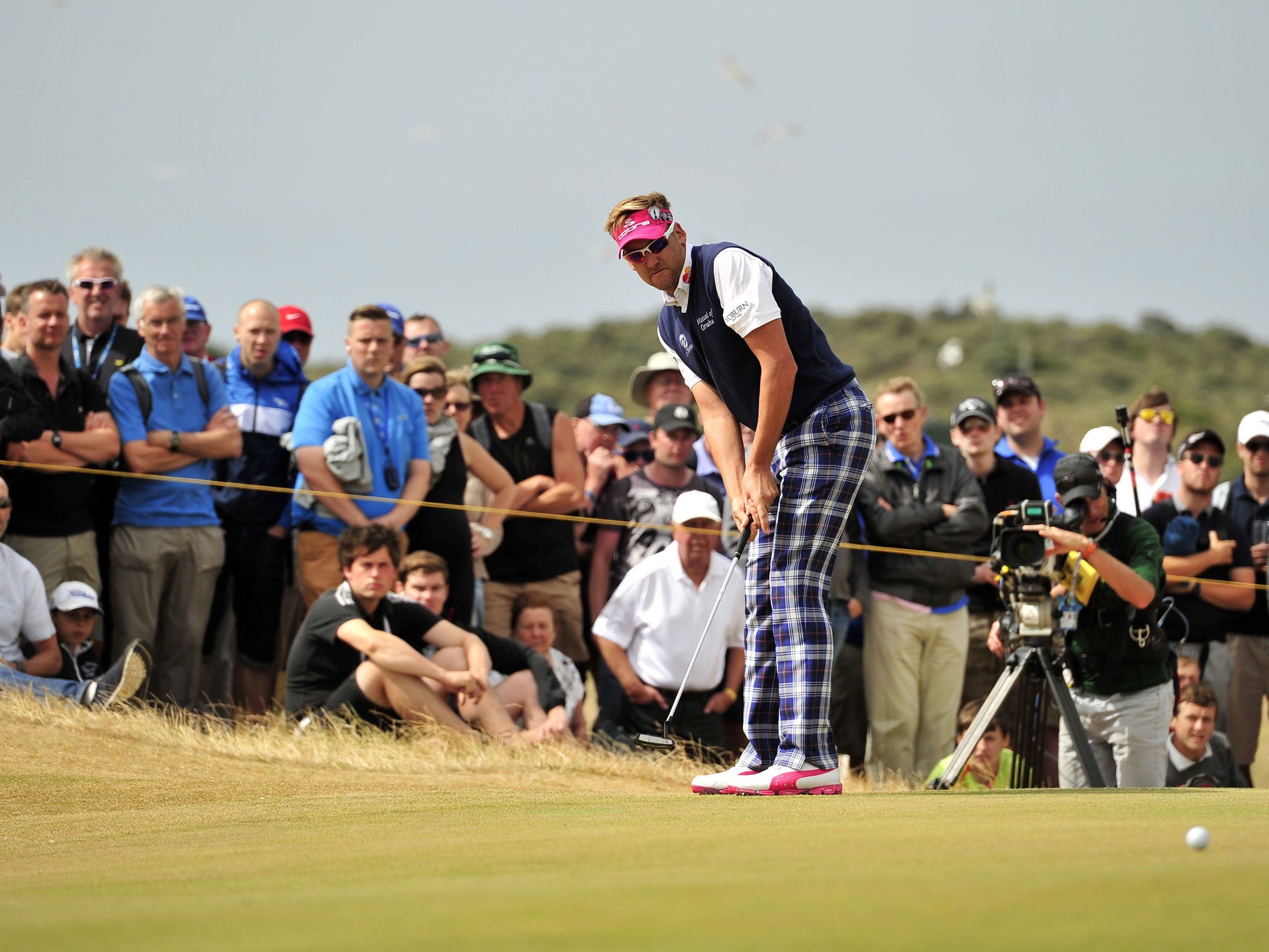 Ian Poulter holes for par on the 14th