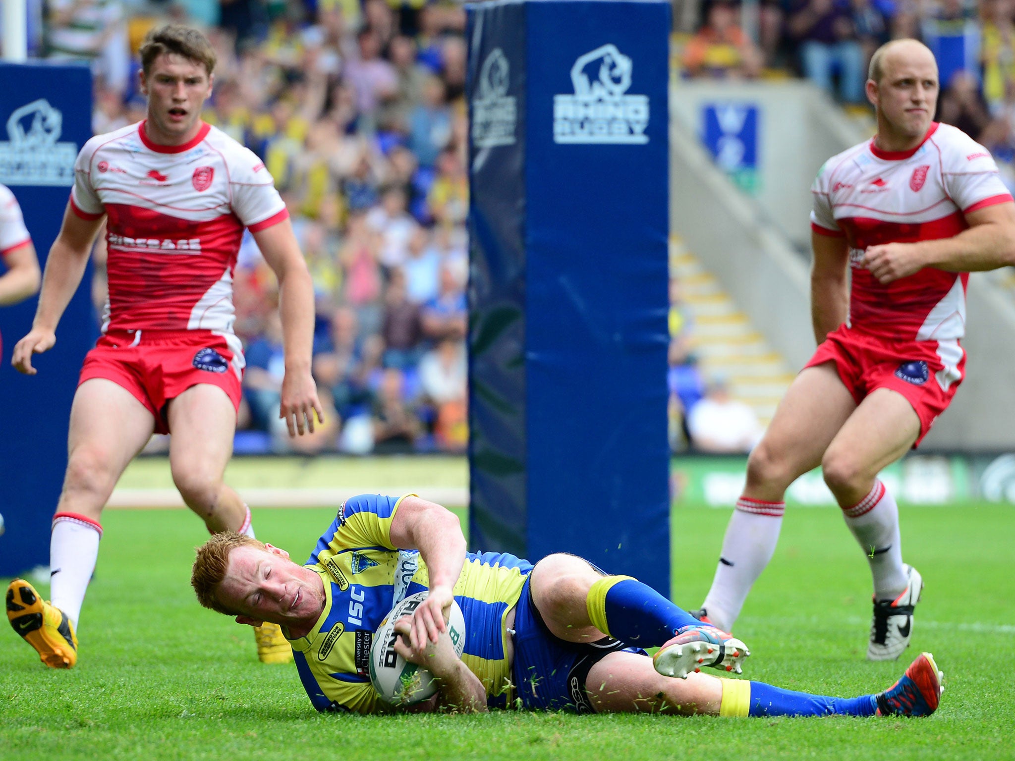 Warrington’s Chris Riley goes over for a try