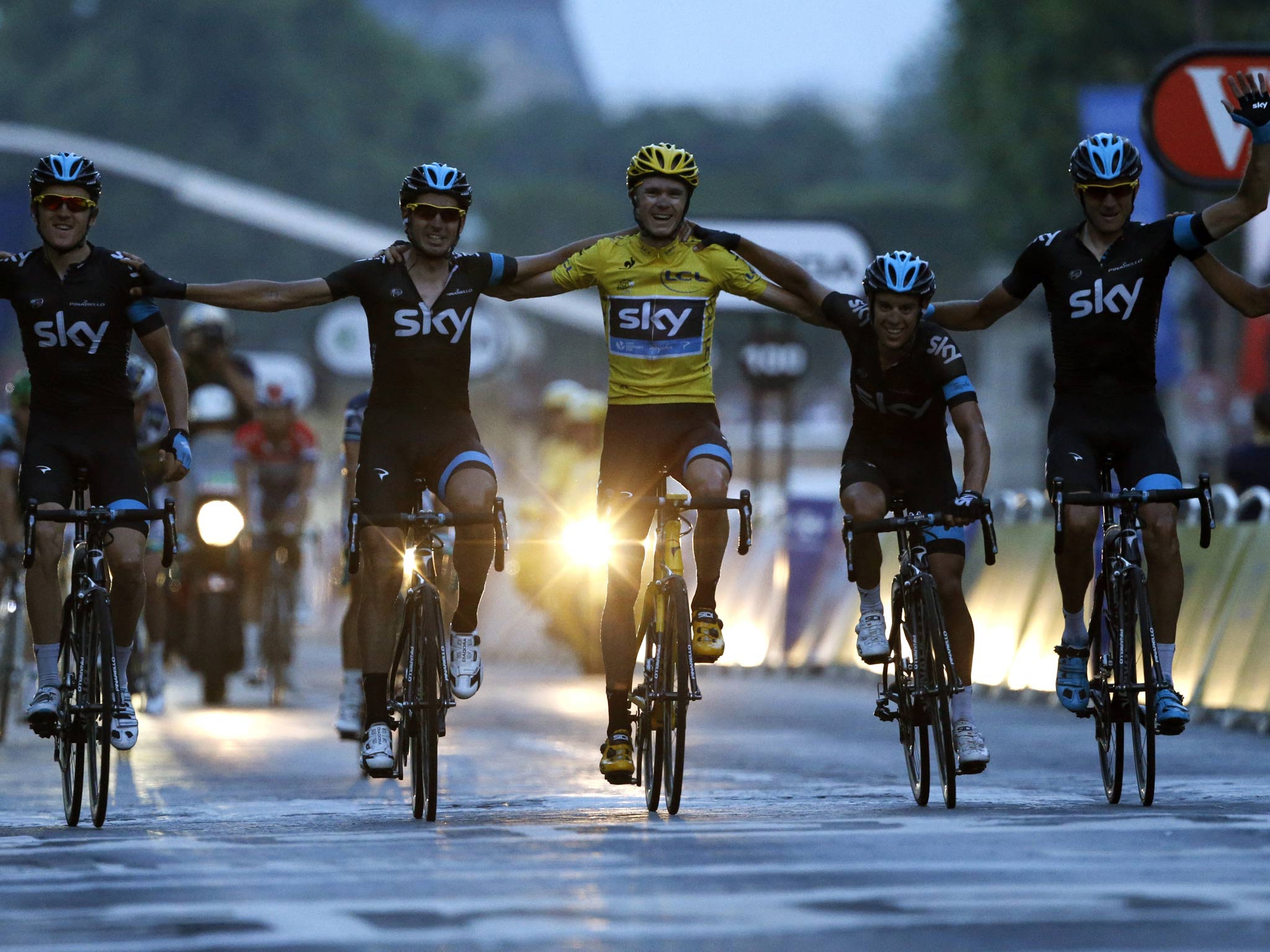 Chris Froome crosses the line with his Team Sky team-mates in 2013