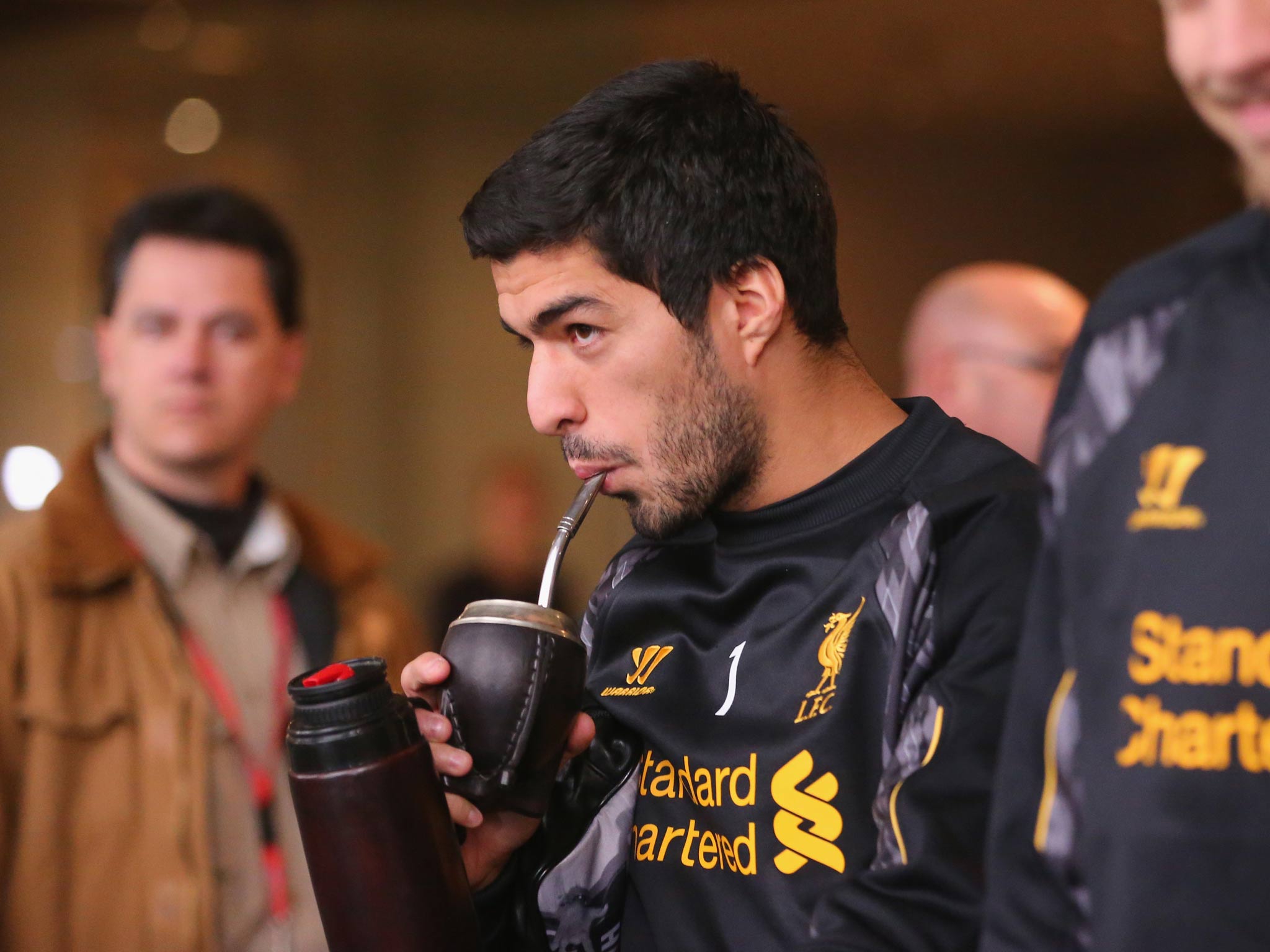 Luis Suarez walks to the team bus to attend training at the Grand Hyatt