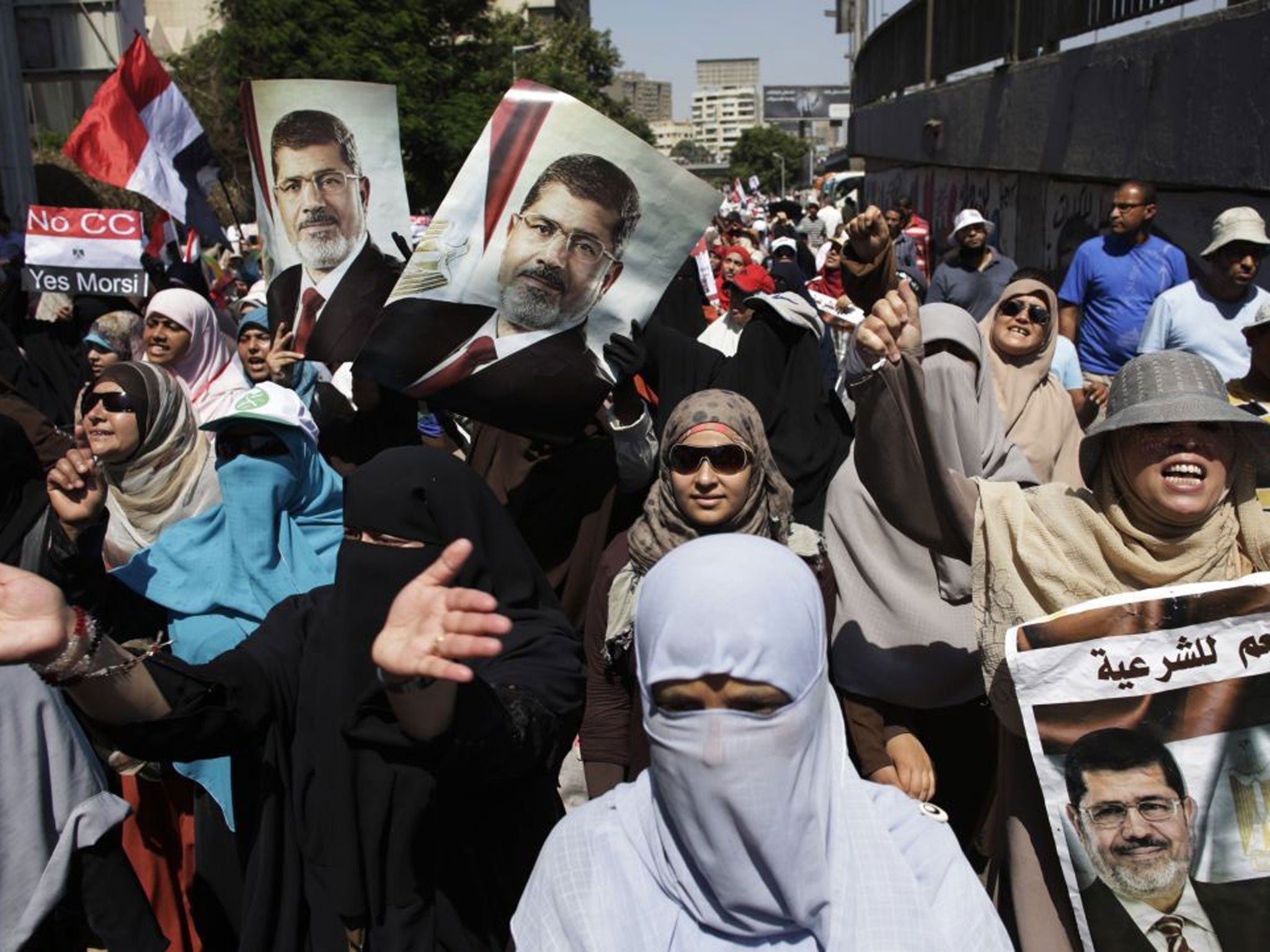 Supporters of Egypt's ousted president Mohammed Morsi chant slogans as they march through Cairo