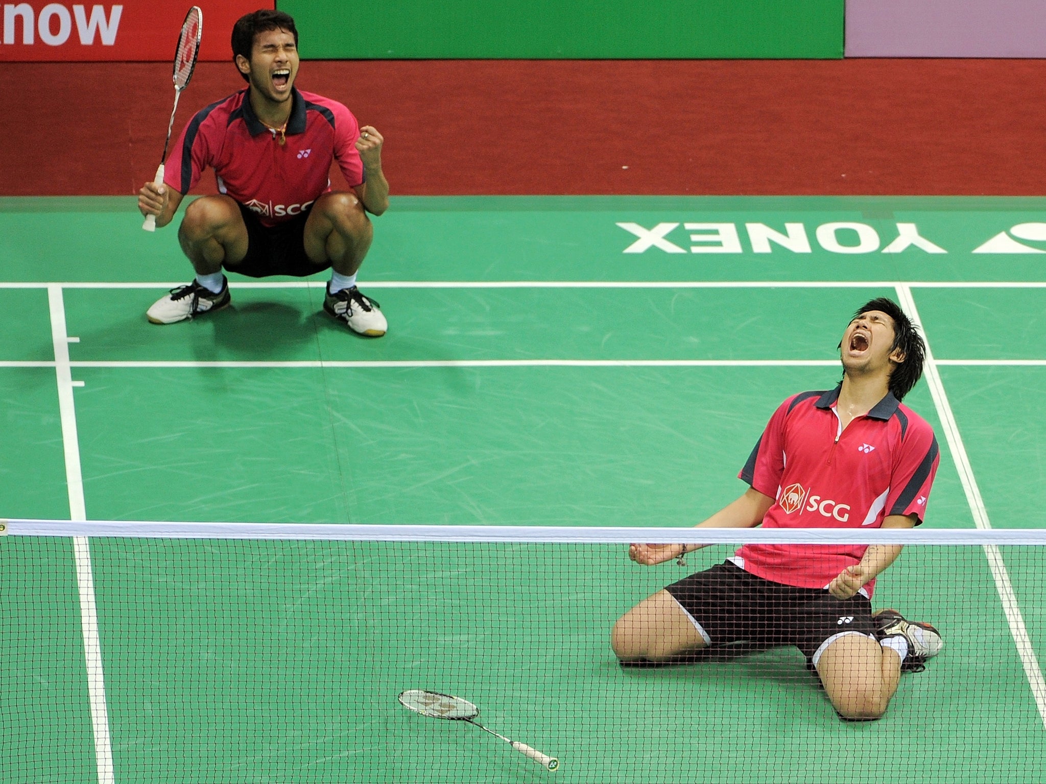Badminton players Issara Bodin (R) and Jongjit Maneepong of Thailand celebrate