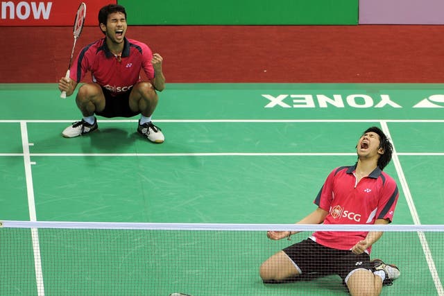 Badminton players Issara Bodin (R) and Jongjit Maneepong of Thailand celebrate