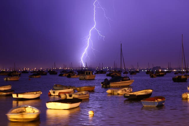 Lightning at Poole Harbour; violent thunderstorms are expected over weekend getaway