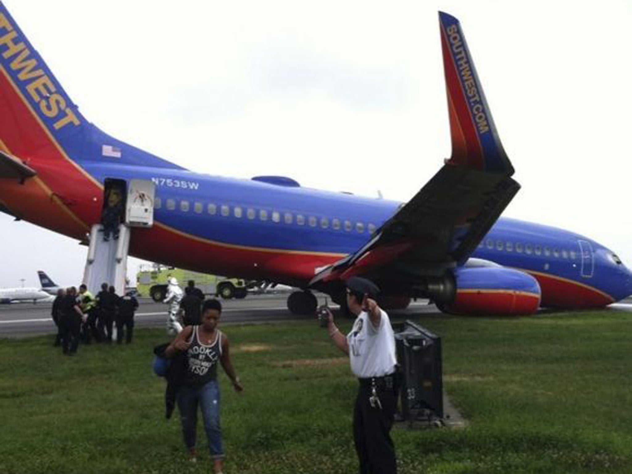 The Southwest Airlines plane sits on the tarmac as passengers disembark at LaGuardia airport, New York